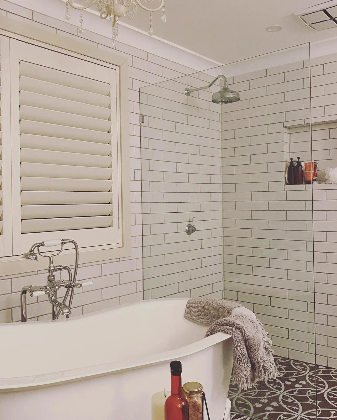 Freestanding bath with subway-tiled shower and plantation shutters, bathroom renovation Northern Beaches