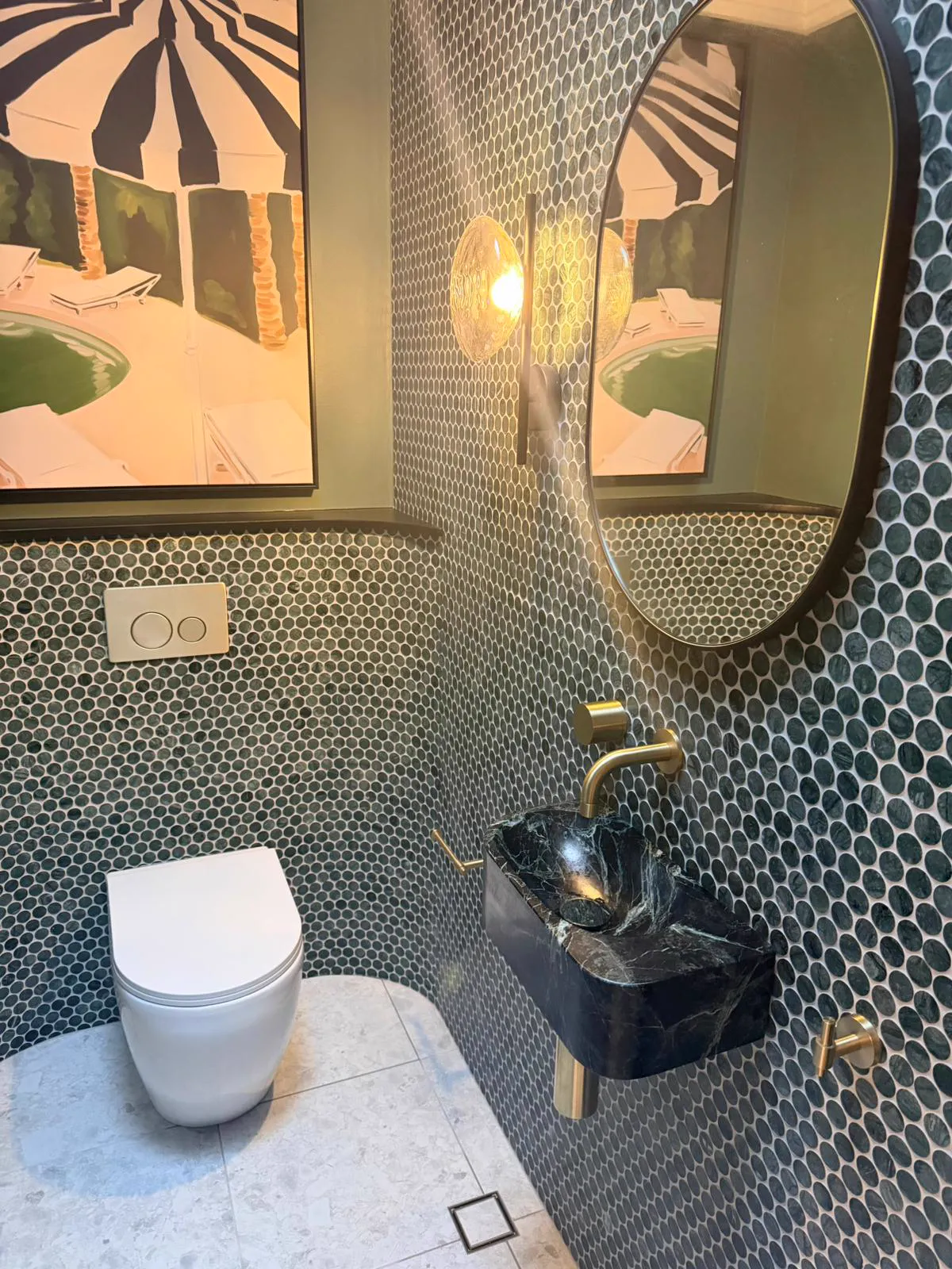 Powder room with green mosaic tiles, marble wall-hung basin and brass tap, Northern Beaches