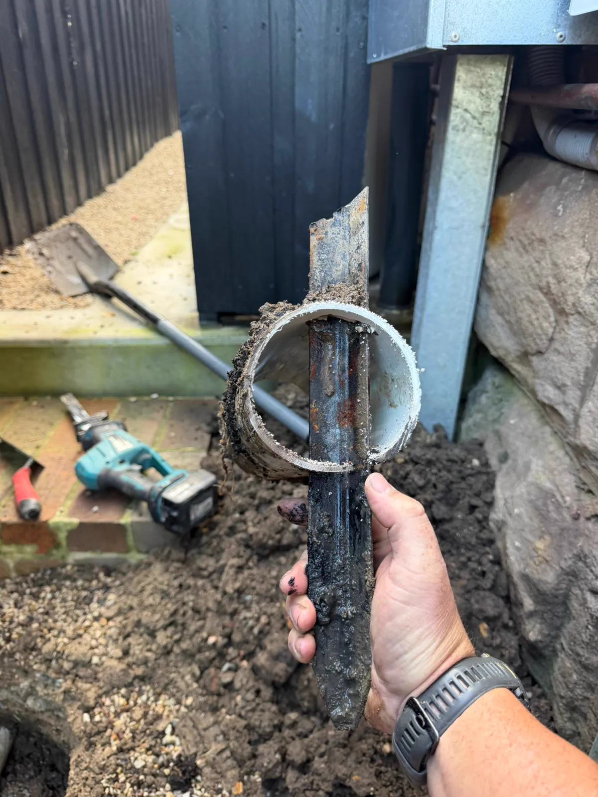 Excavated damaged drain pipe section during a drain repair, Northern Beaches